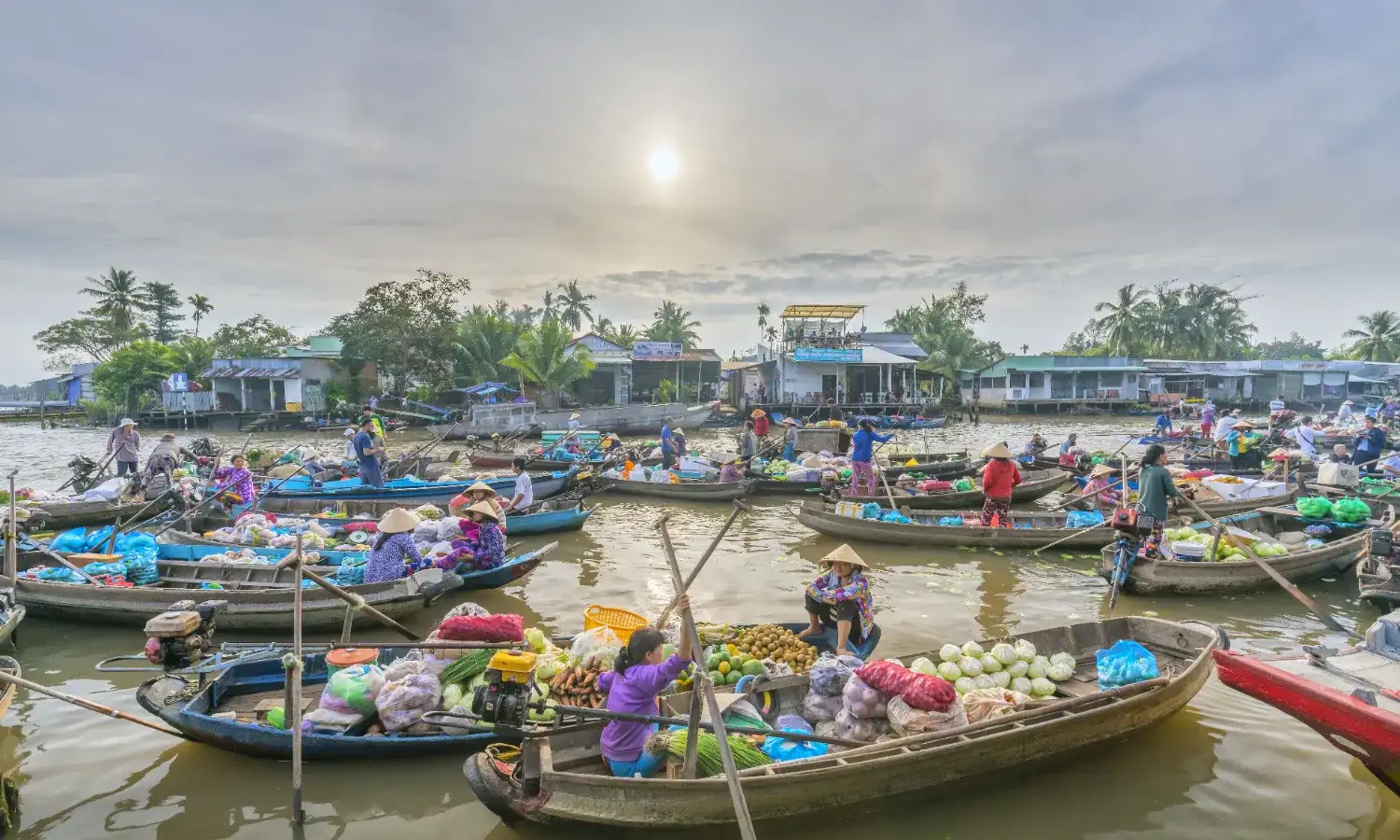 Take a boat tour to Cai Rang floating market at sunrise