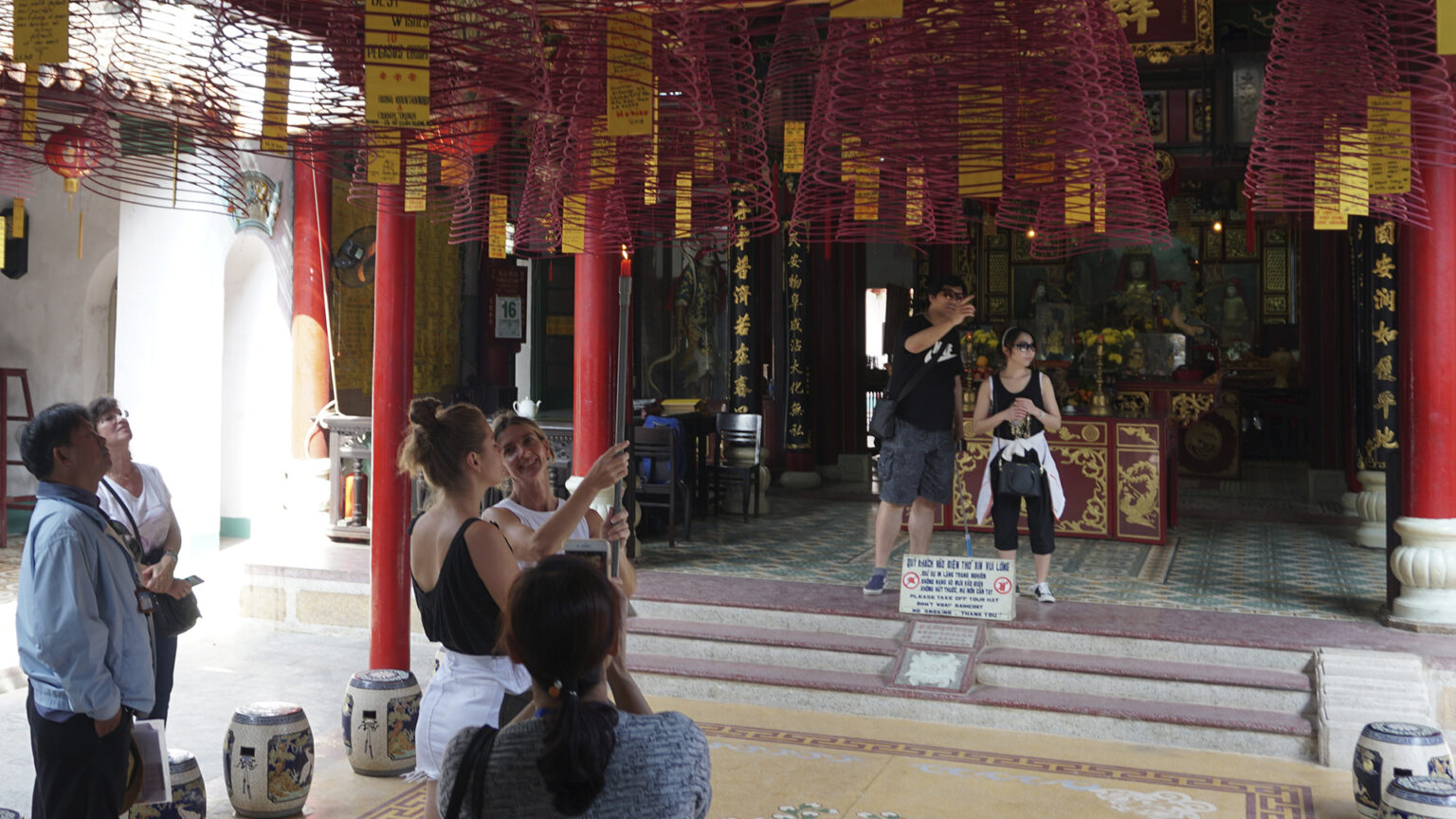 visitors-making-wishes-with-large-incense-coils